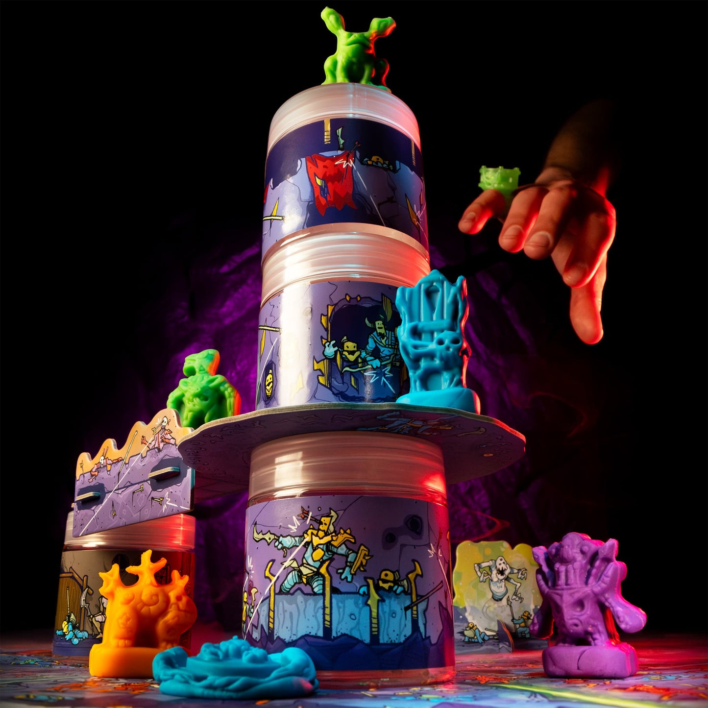 
                  
                    Colorful clay figures battling around a terrain tower built from clay containers
                  
                