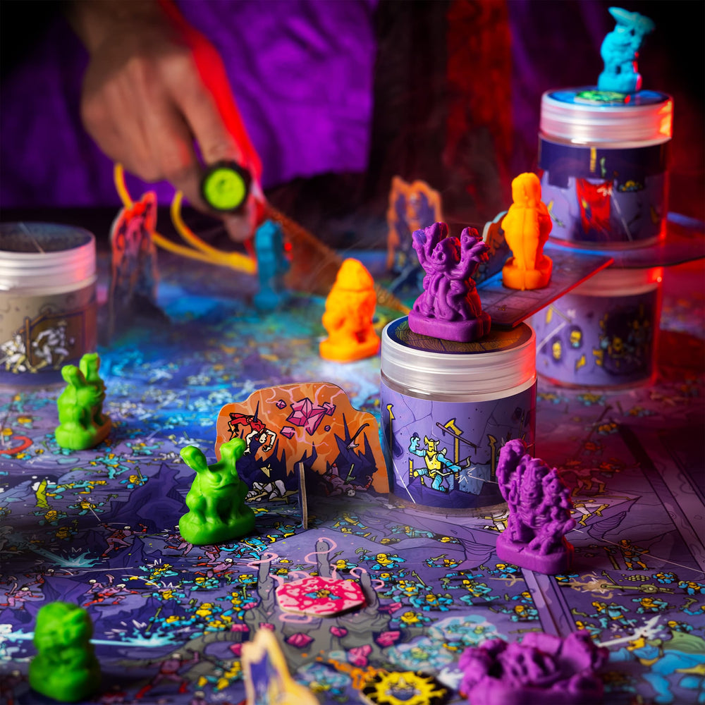 
                  
                    Colorful clay monster miniatures battling on an illustrated wargame map
                  
                
