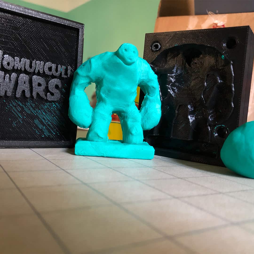 A golem monster made from play doh molded from a 3D printed spellbook toy for the warhammer like wargame Necromolds.