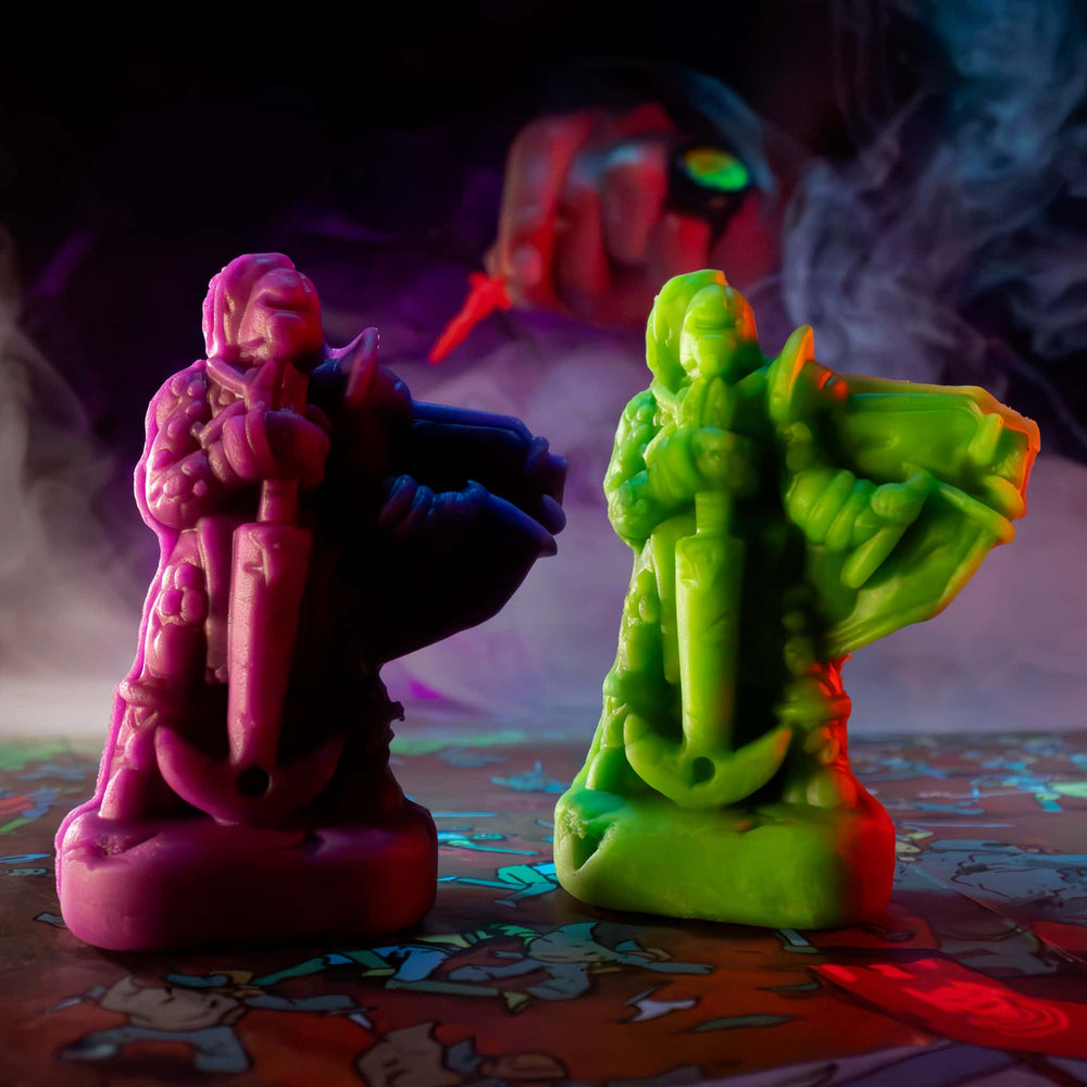 
                  
                    Two Blood Mump monster miniatures molded from purple and green clay (compare to play dough) in a Necromolds board game
                  
                